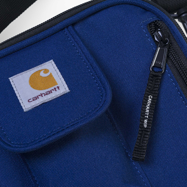 eine kleine Smartphone und Münz- und Geldscheintasche mit Zipper auf der Vorderseite