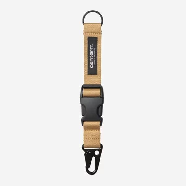 Carhartt Wip Click Key Band Dusty in braun mit schwarzem Clip, ideal für Schlüsselorganisation und -sicherung.