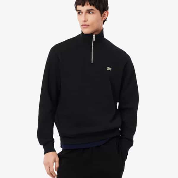 Schwarzer Lacoste Rippstrick Half Zip Pullover mit Reißverschluss und Logo-Details, modisch und bequem für den Alltag.