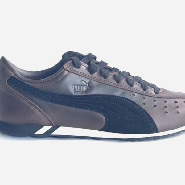 Retro Puma Sprint Dressed Turnschuh in Braun mit schwarzer Sohle und klassischen Design-Details, ideal für sportliche Freizeitaktivitäten.
